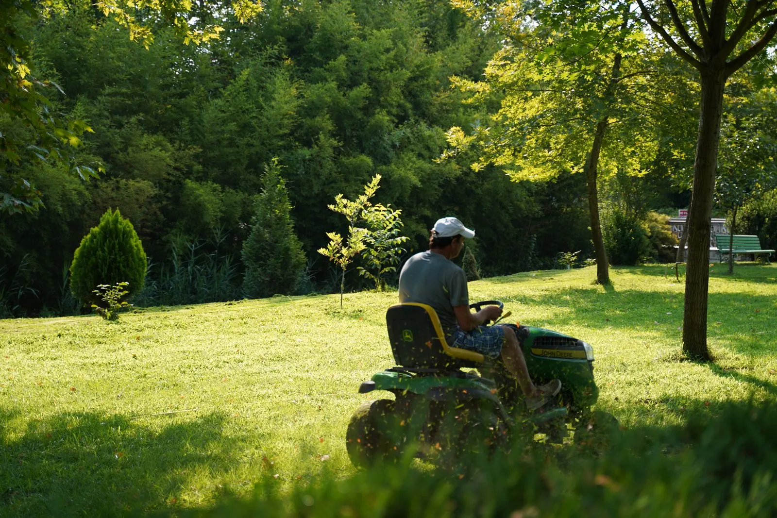 Lawn care crew mowing a residential yard in Buffalo, NY
